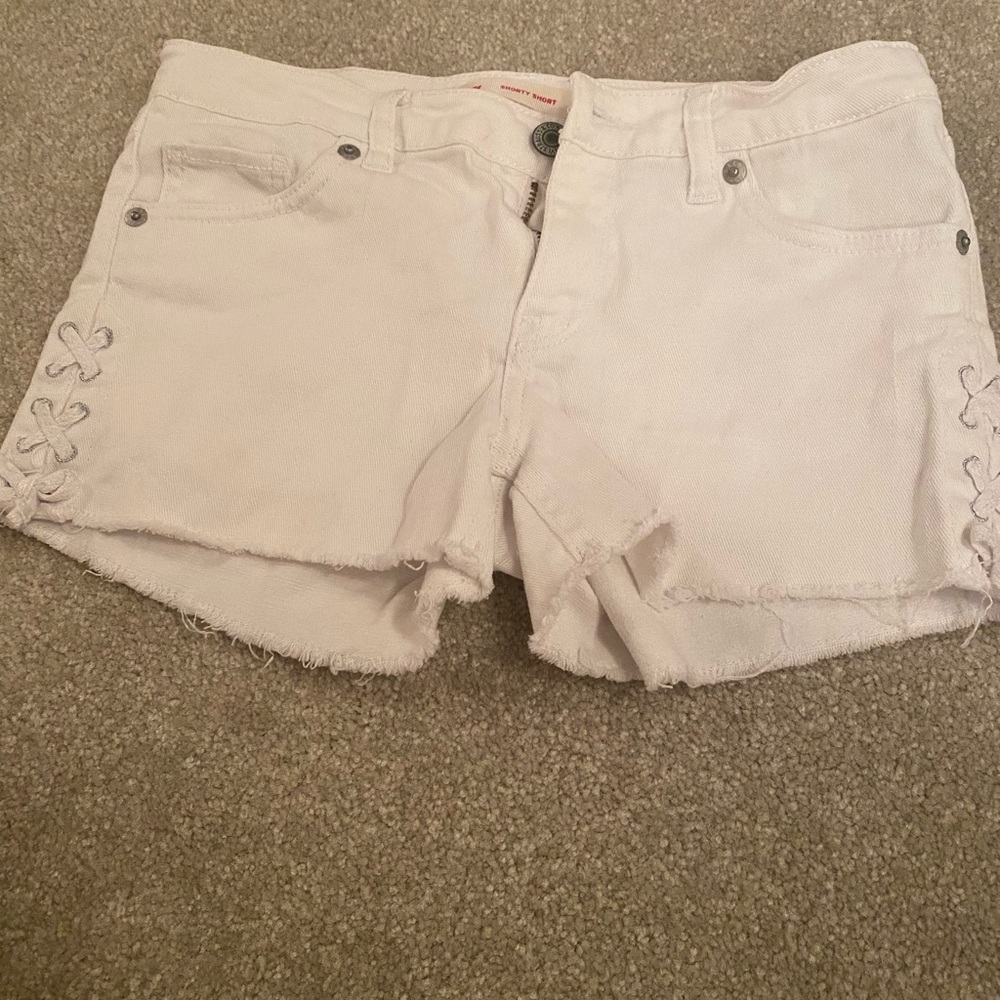 Levi’s white jean shorts with design in the front